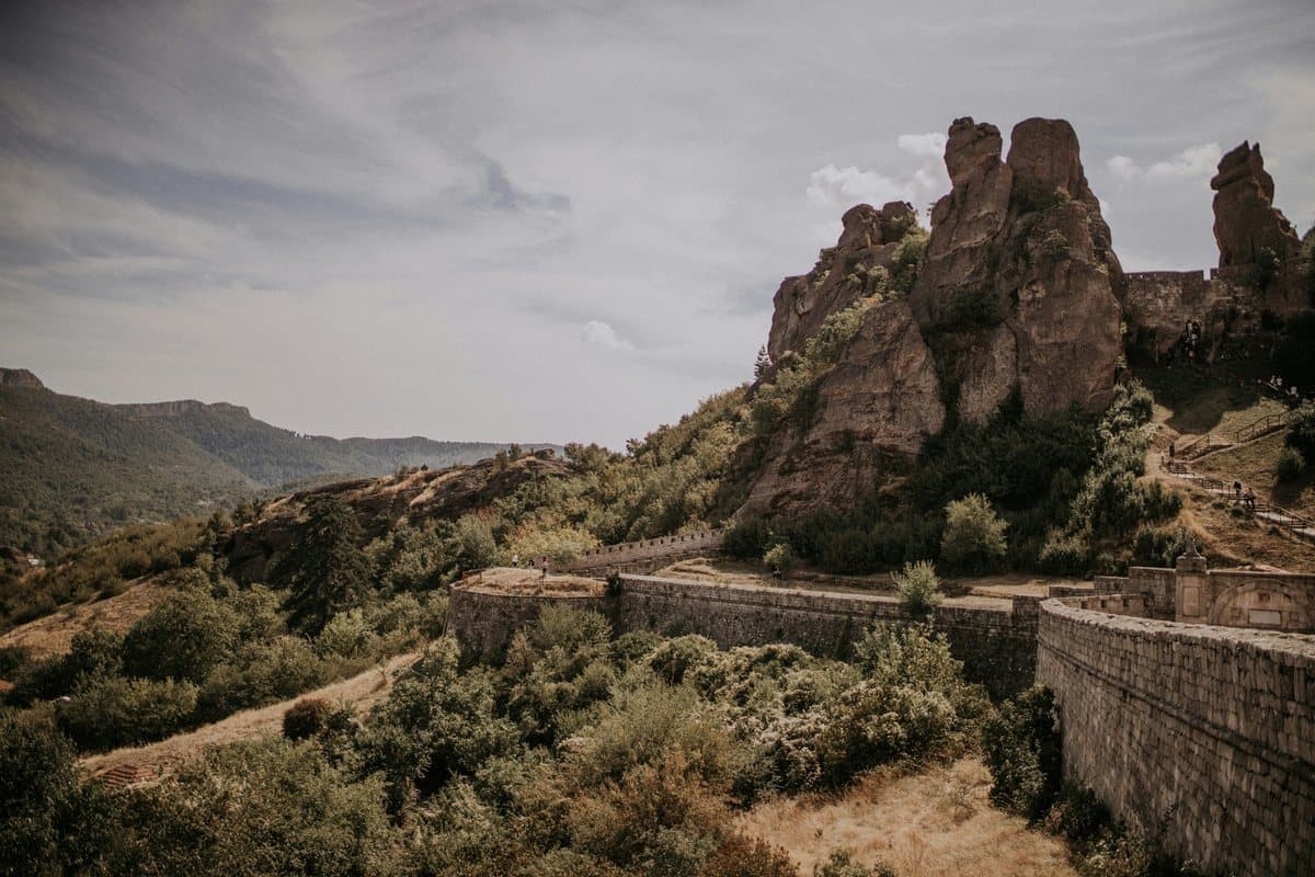 The stone walls of Belogradchik Fortress below its sandstone rock towers, Bulgaria